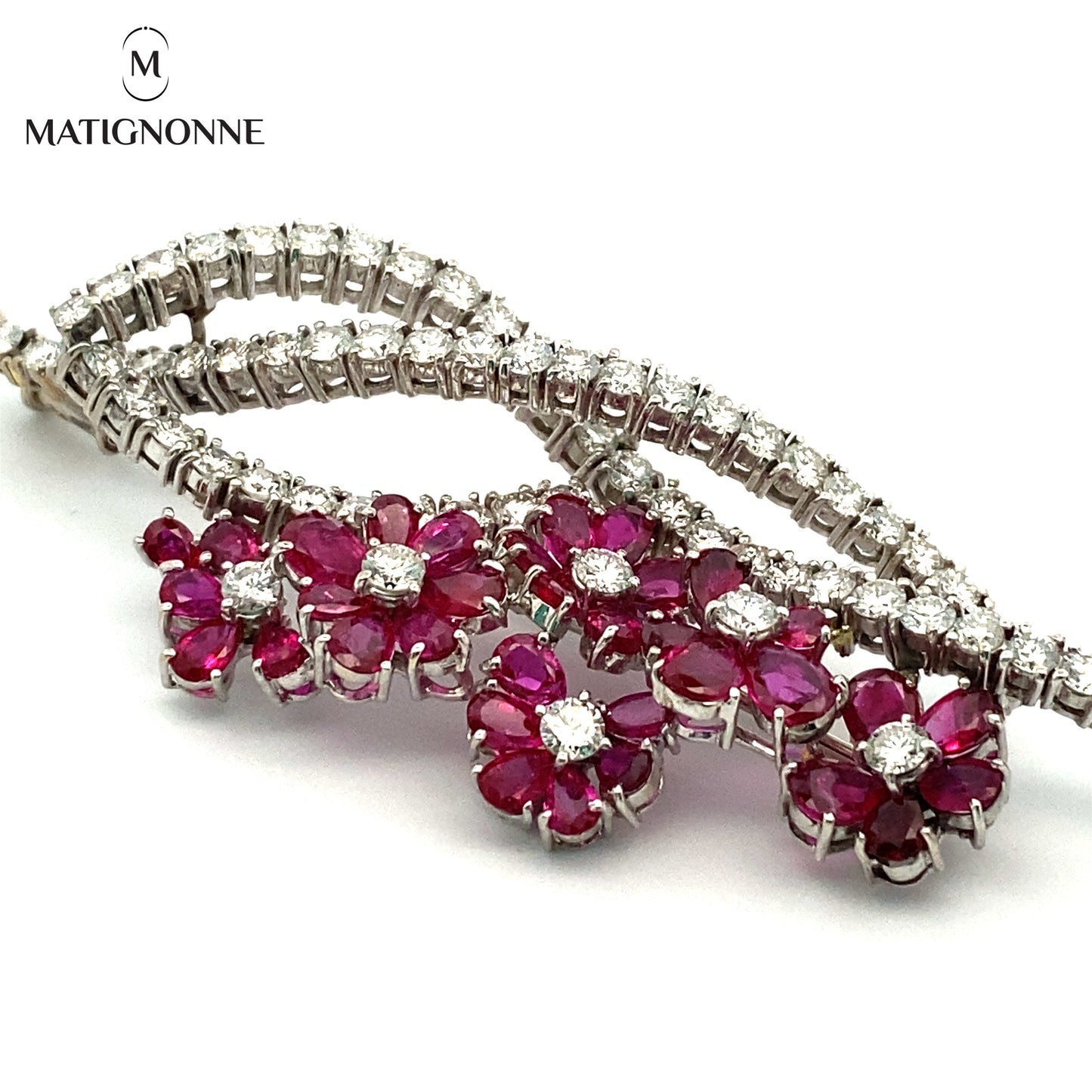 Fine jewelry brooch with diamonds and rubies