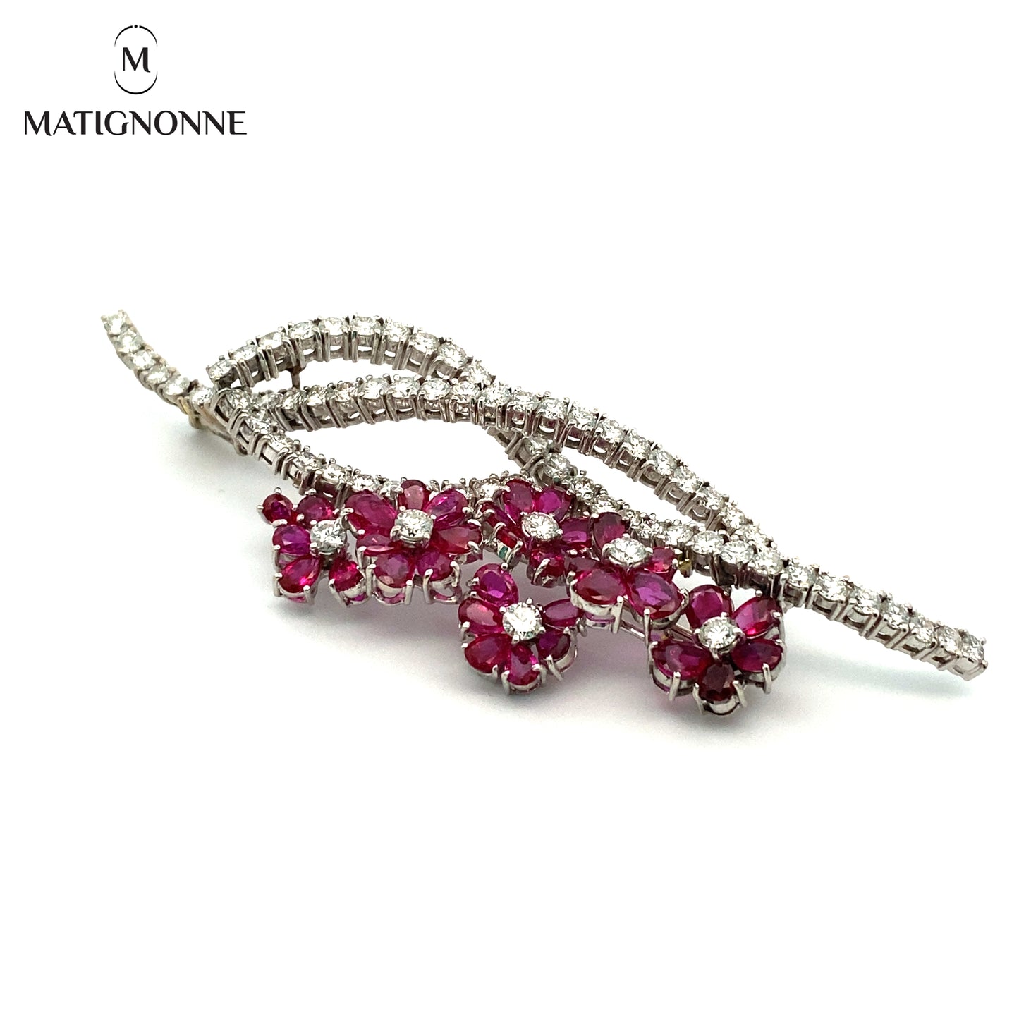 Fine jewelry brooch with diamonds and rubies