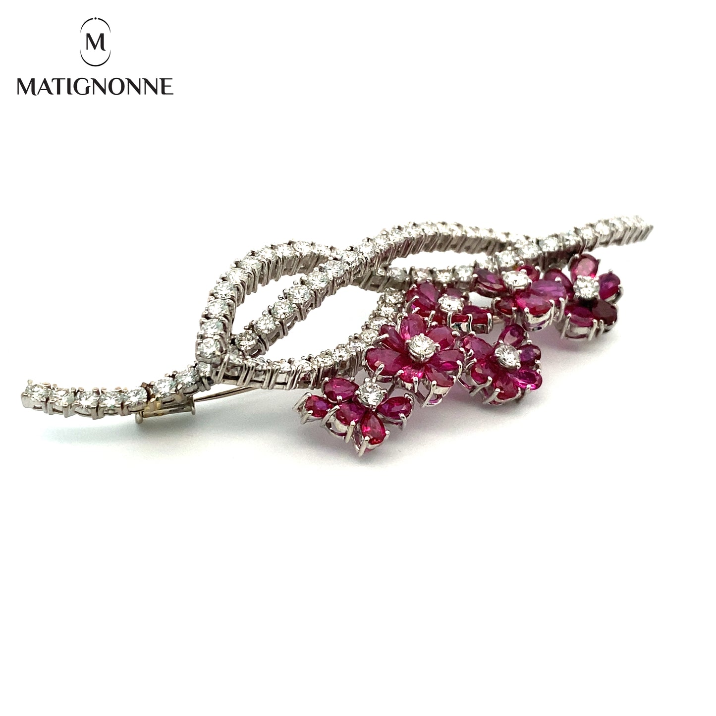 Fine jewelry brooch with diamonds and rubies