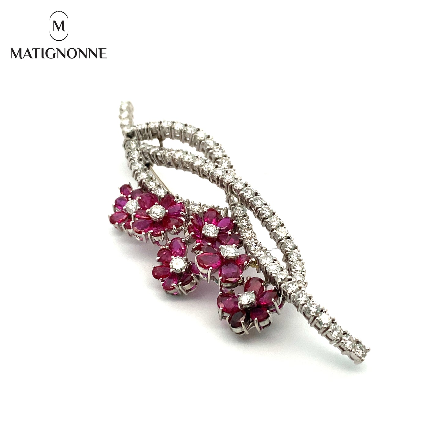 Fine jewelry brooch with diamonds and rubies