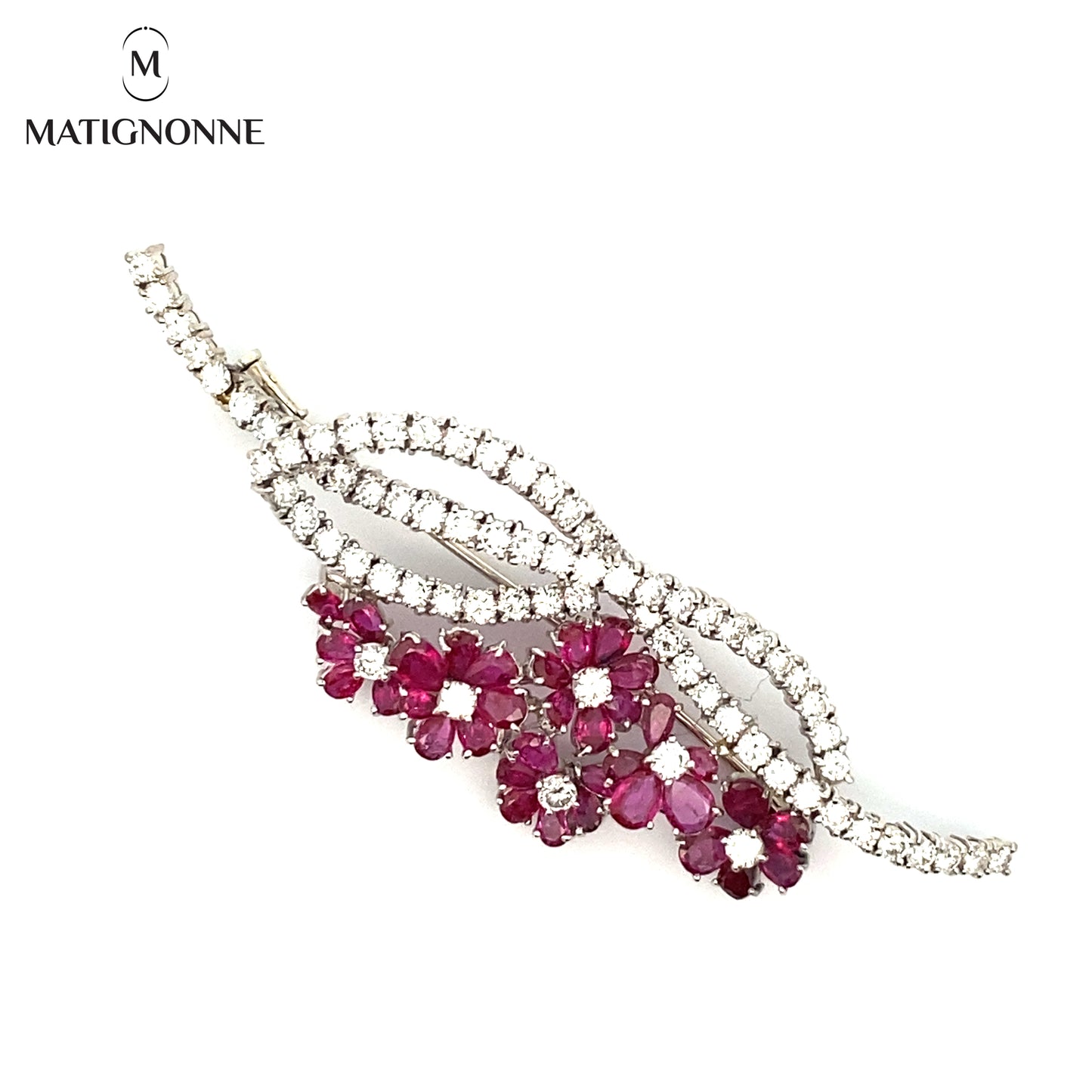 Fine jewelry brooch with diamonds and rubies